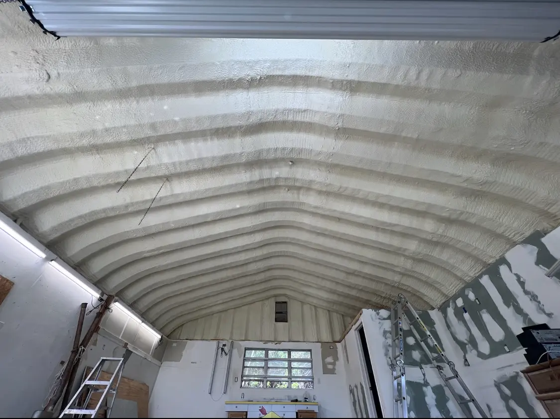 Spray polyurethane foam applied to the underside of a metal roof deck in Winslow